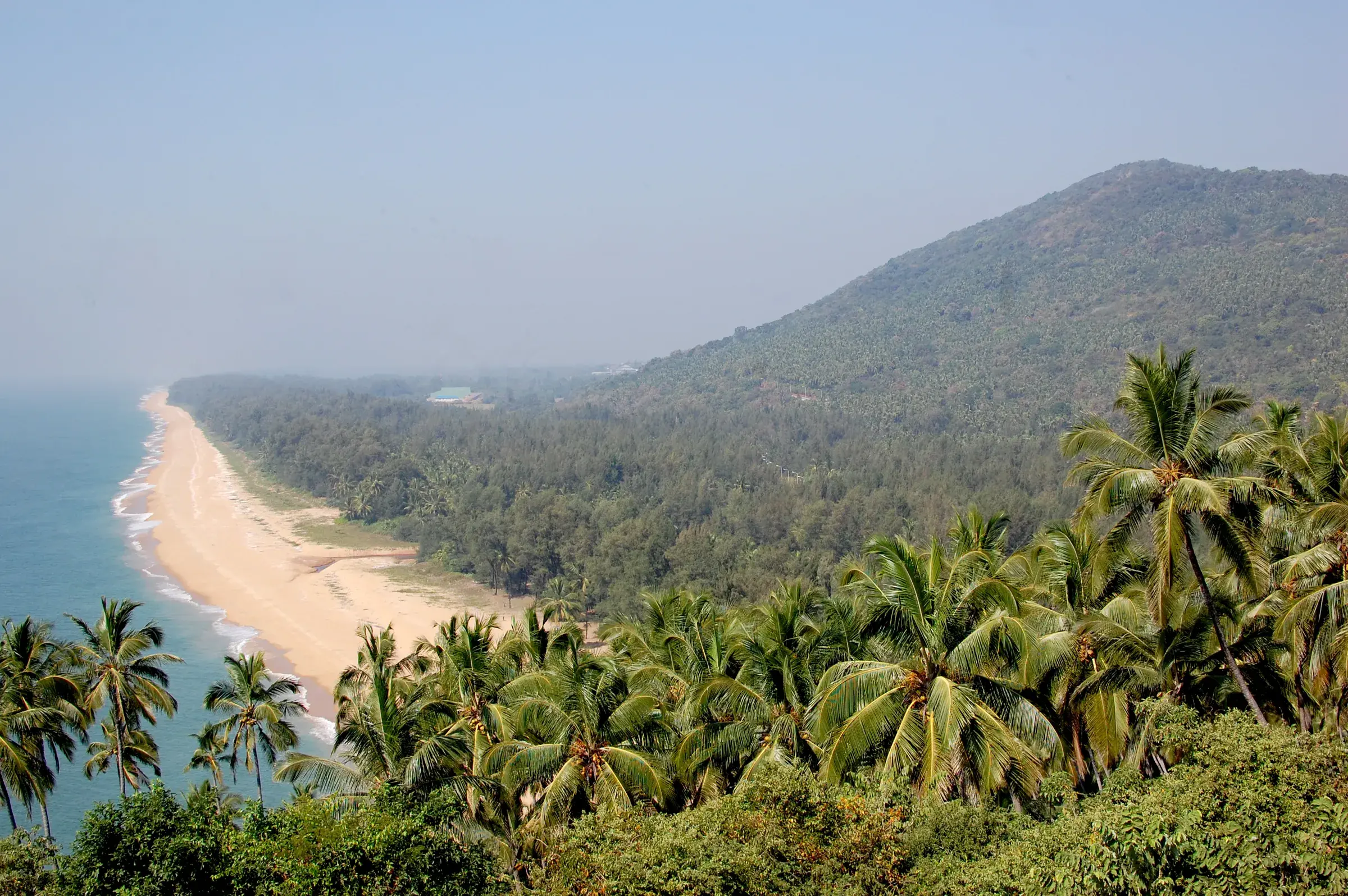Ezhimala hill rising behind the beach