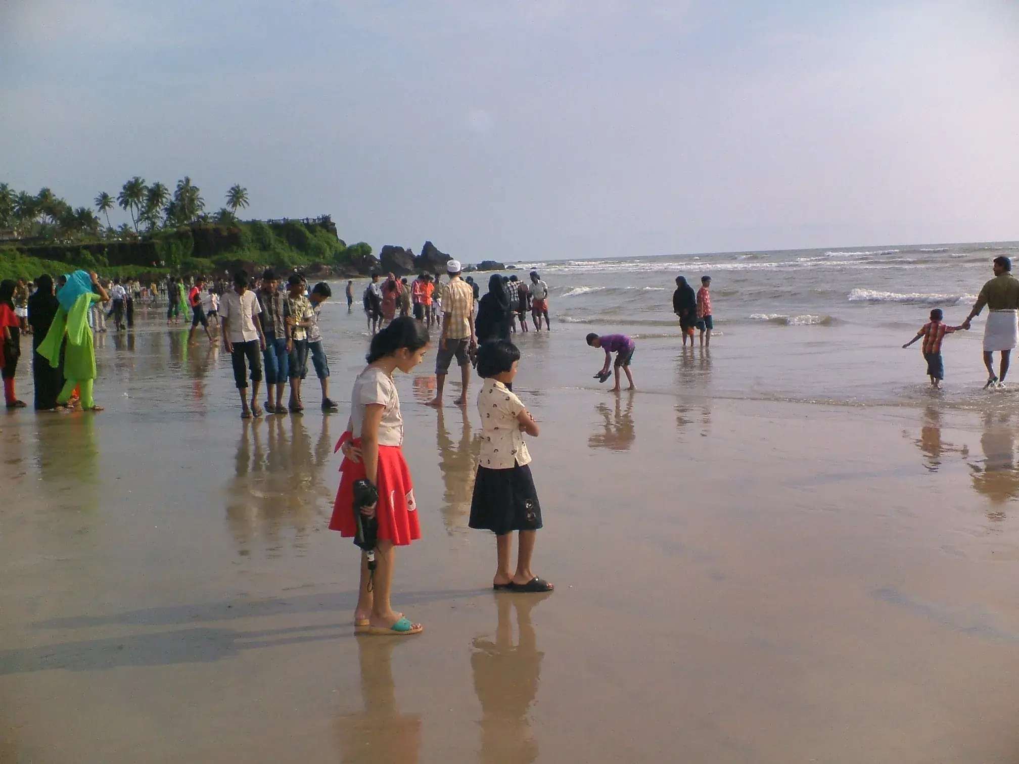 People enjoying the evening at Payyambalam Beach