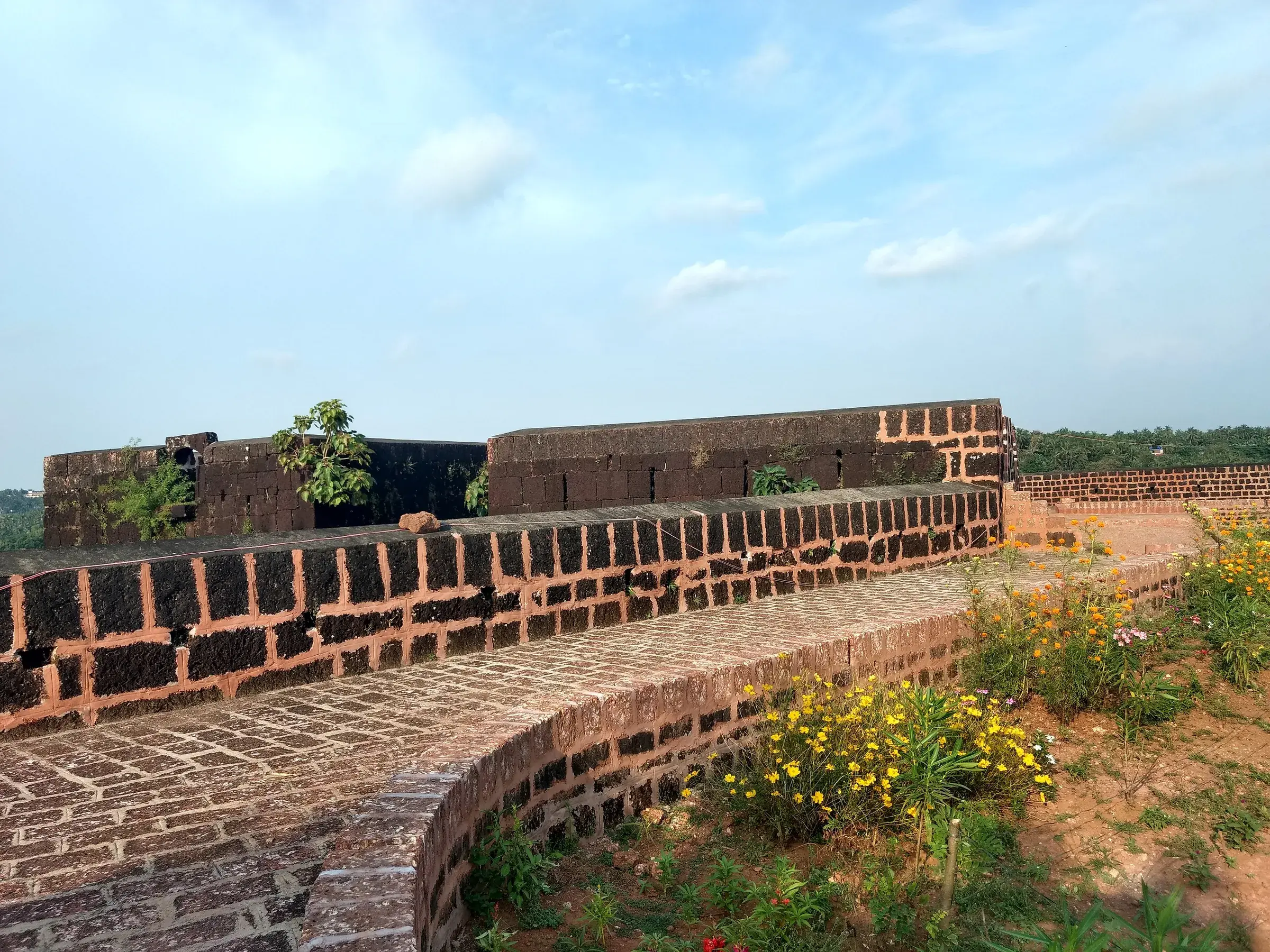 The walls of Chandragiri Fort above the river