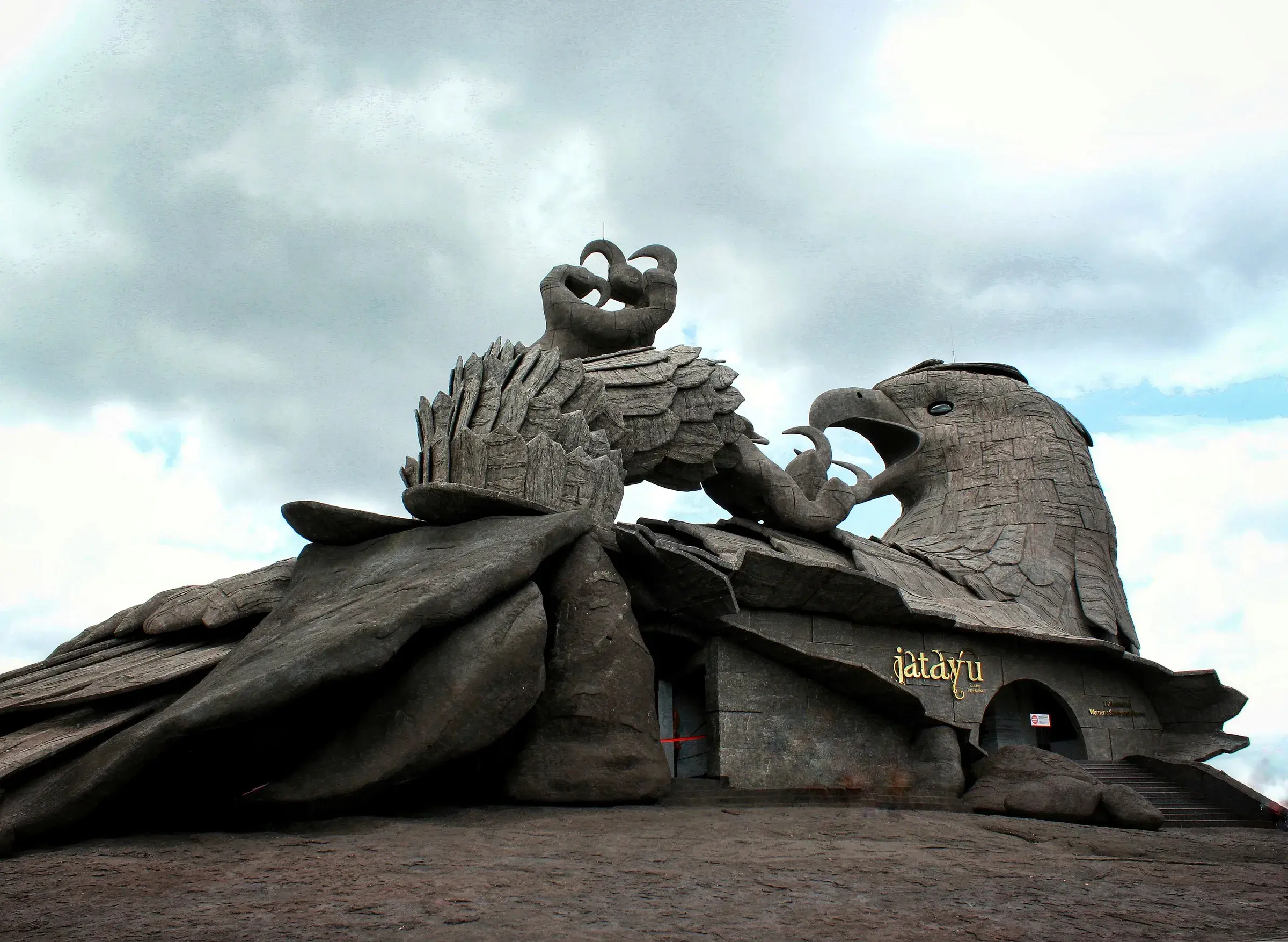 The giant stone sculpture of the bird Jatayu on a rocky hilltop