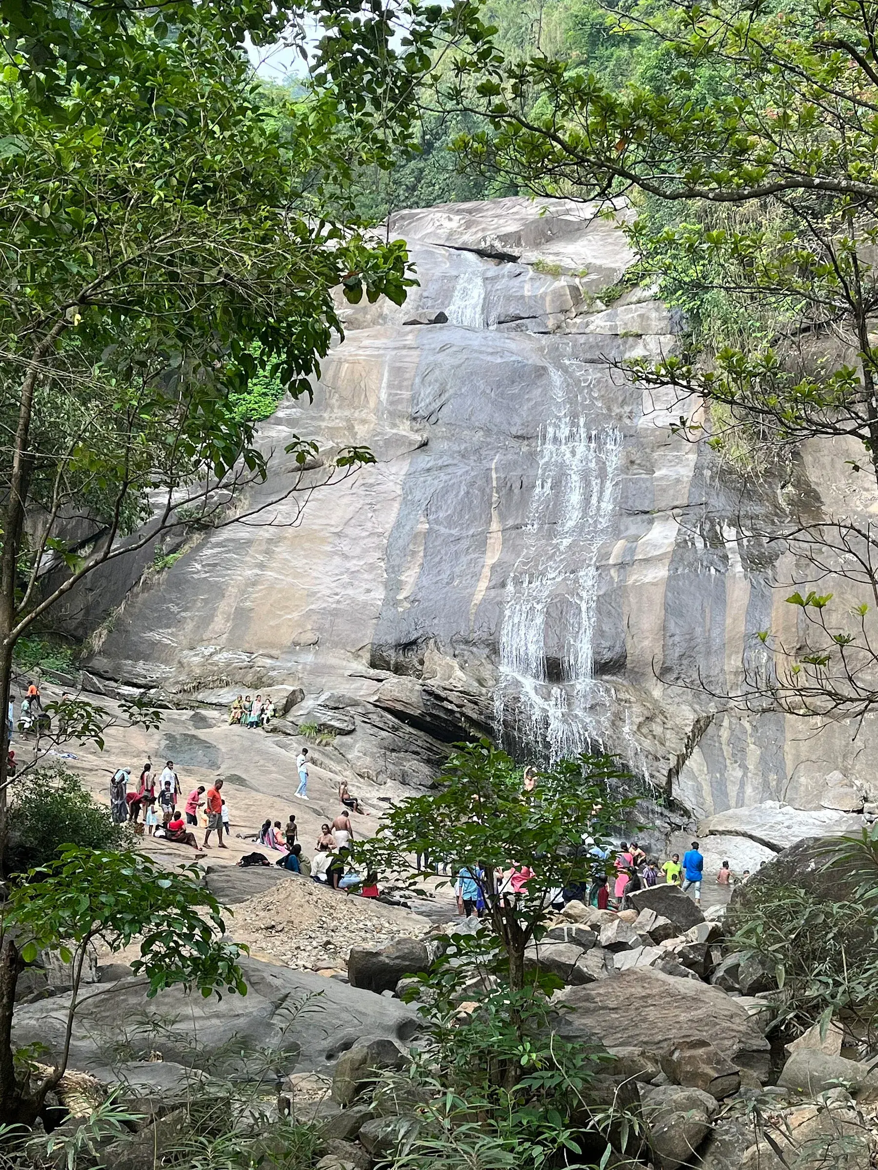Water falling over rocks in the forest at Thusharagiri