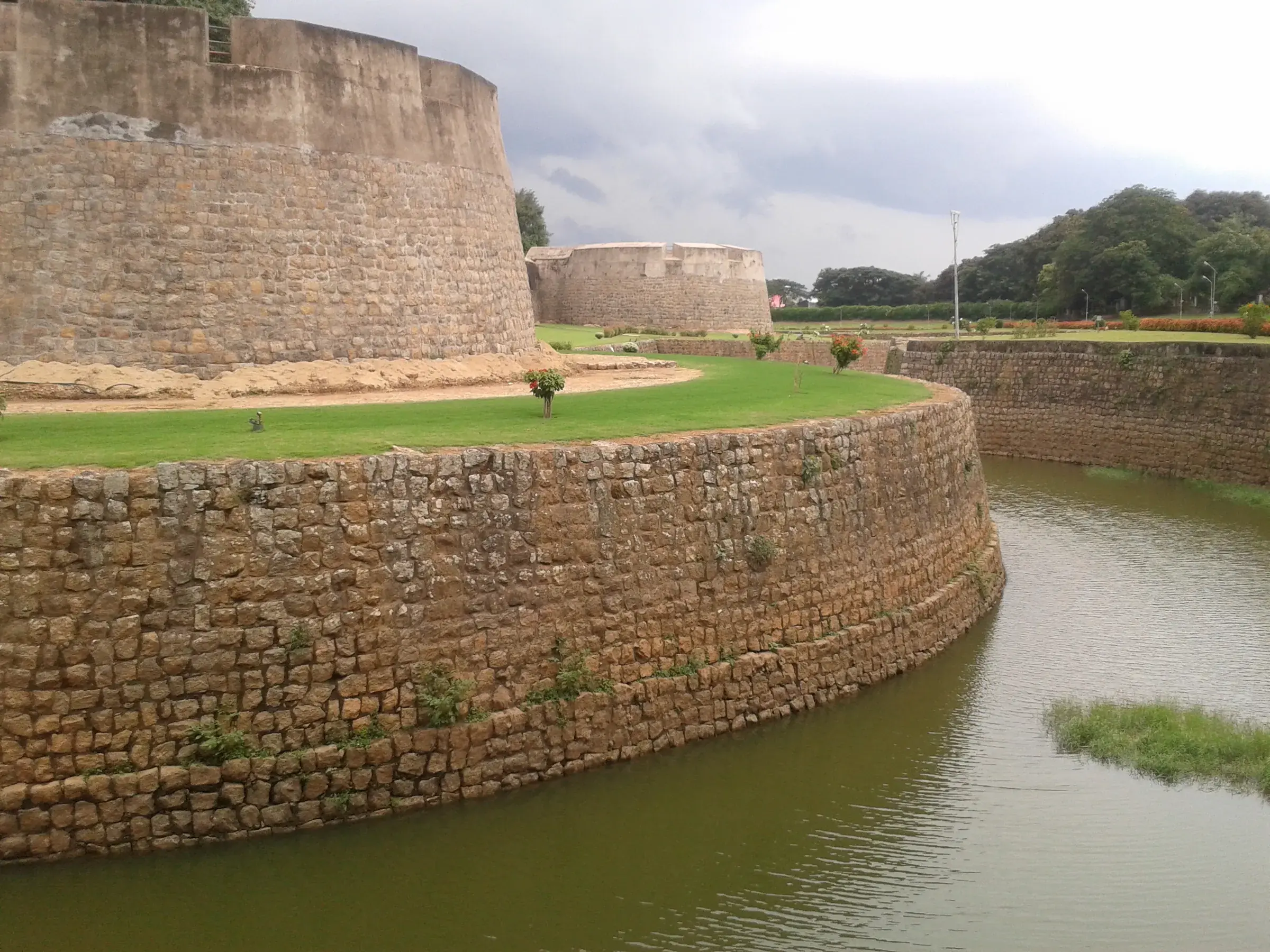 The granite walls and moat of Palakkad Fort