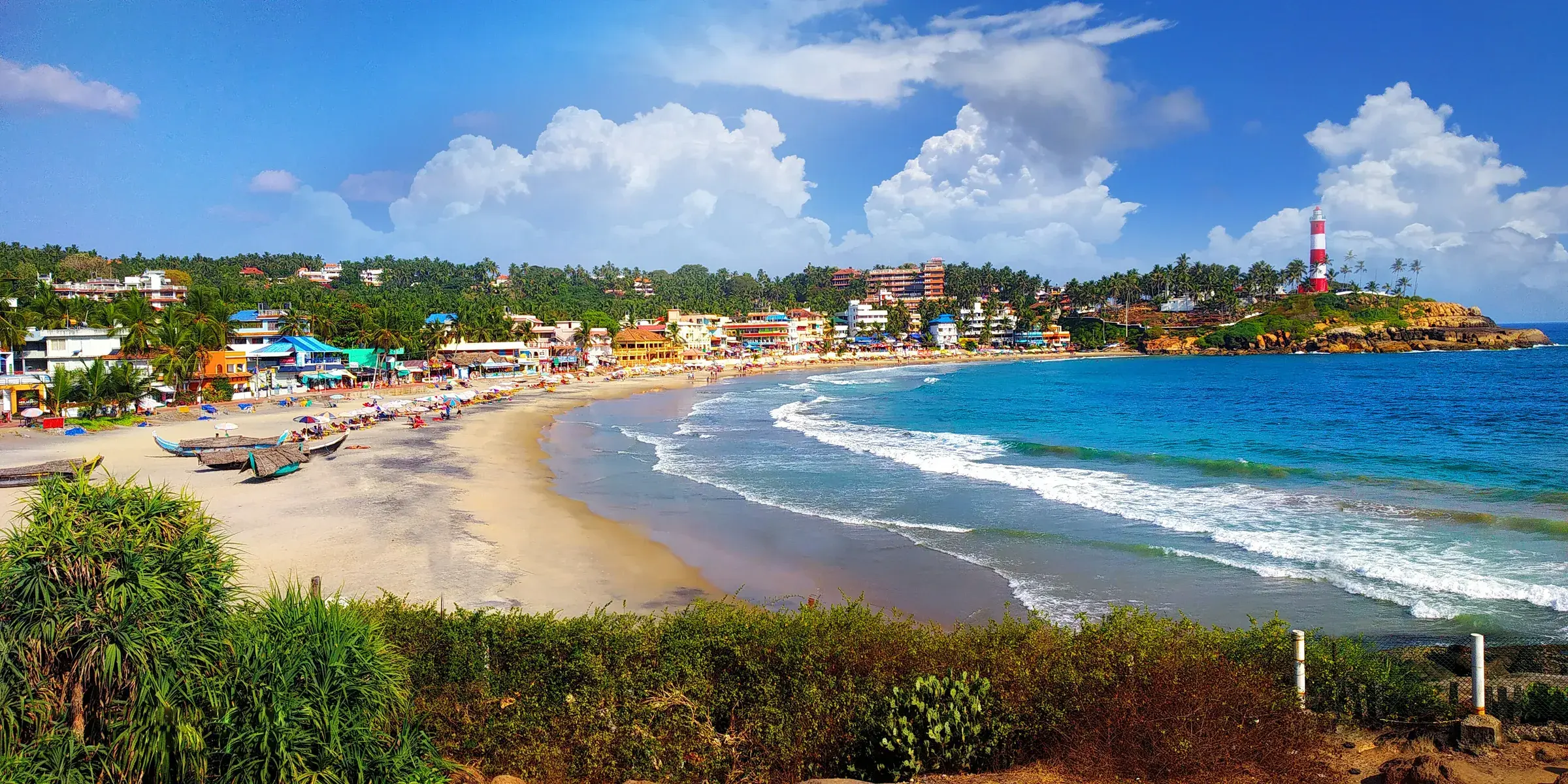 Waves breaking on the crescent beach of Kovalam