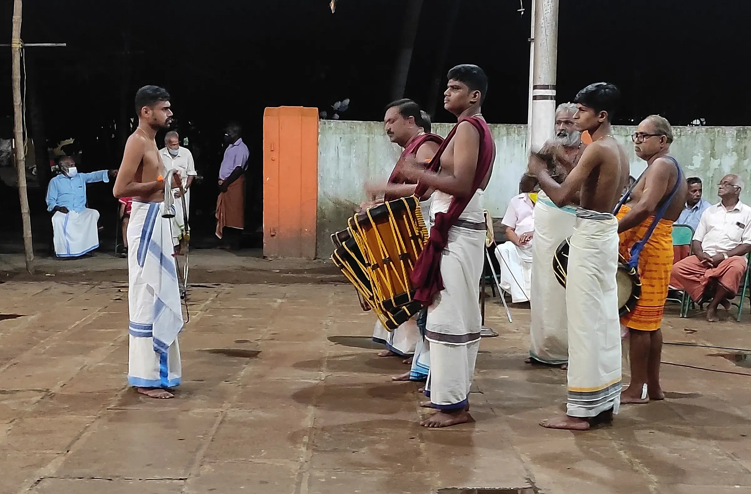 Chenda drummers performing in a row
