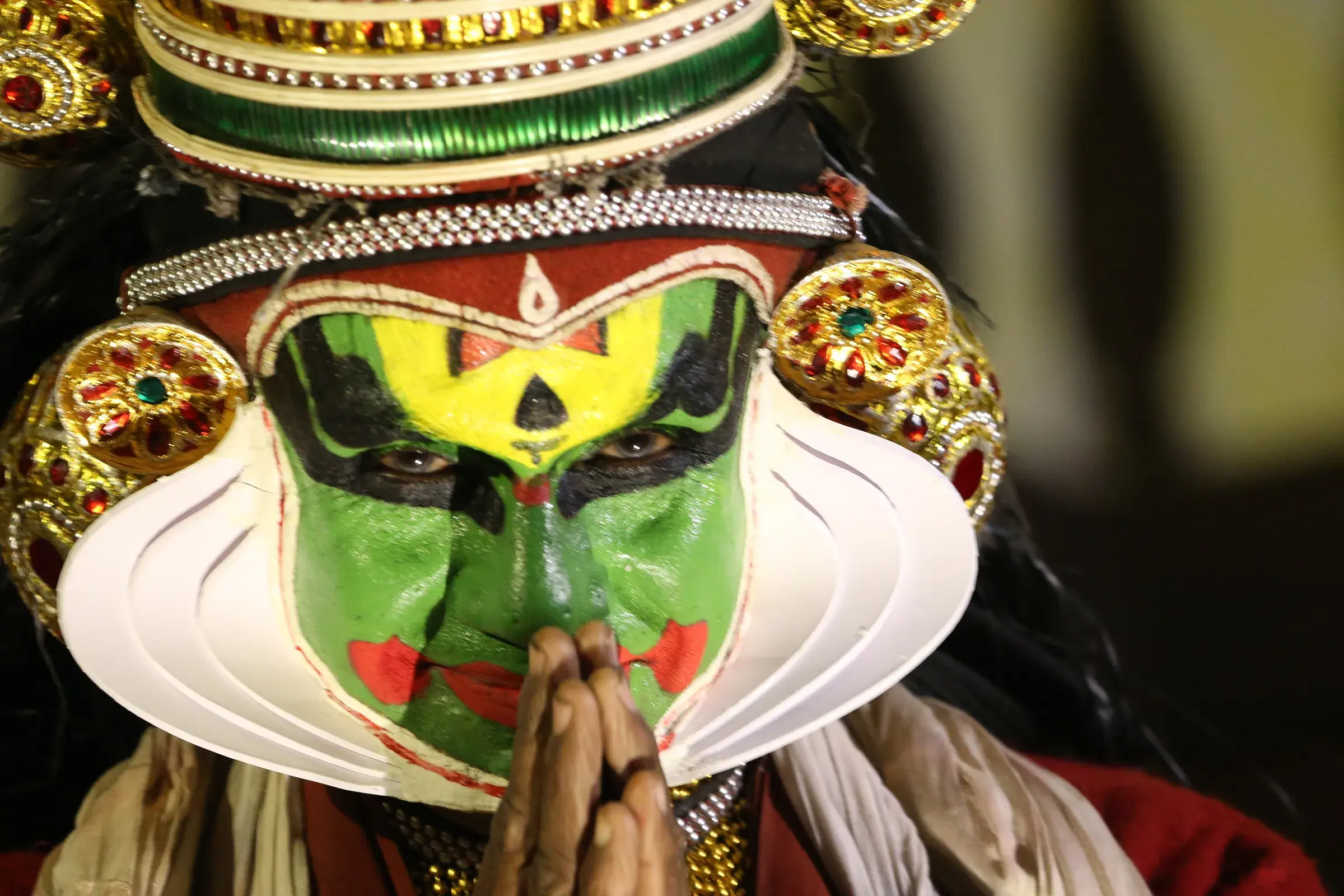 A Kathakali performer in green make-up