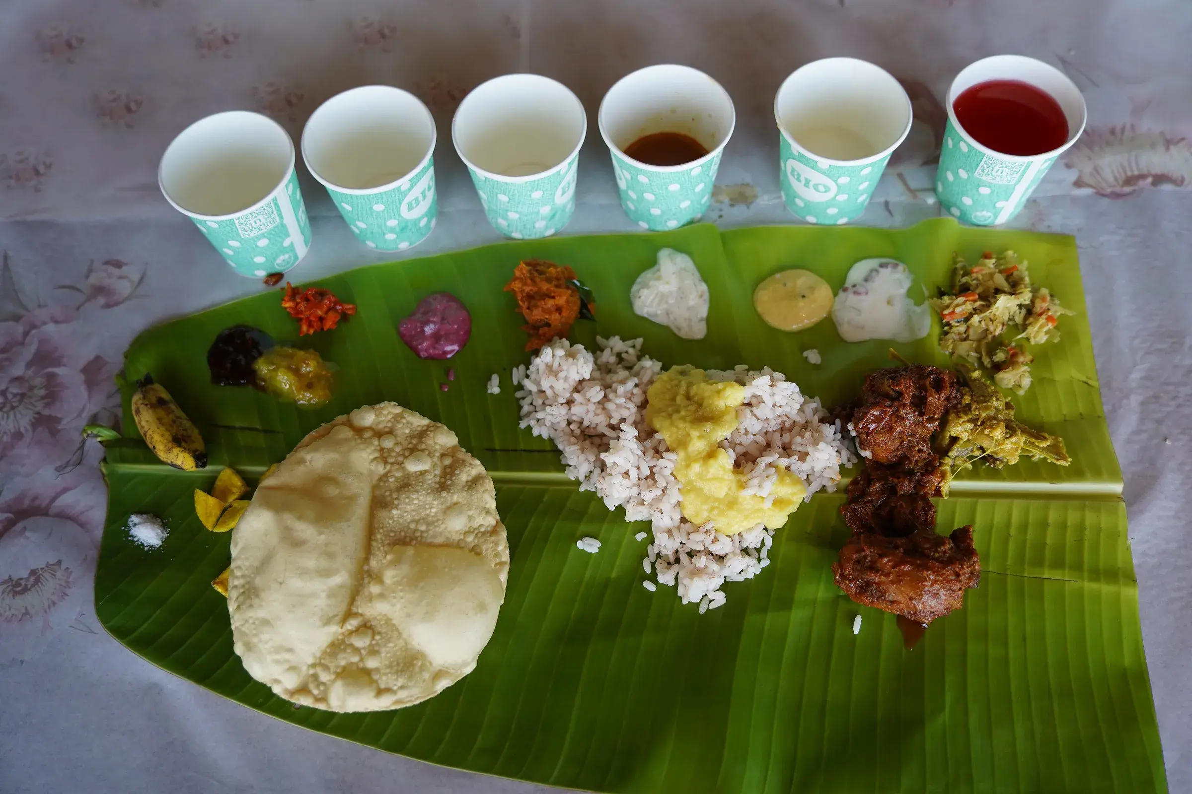 An Onam feast on a banana leaf