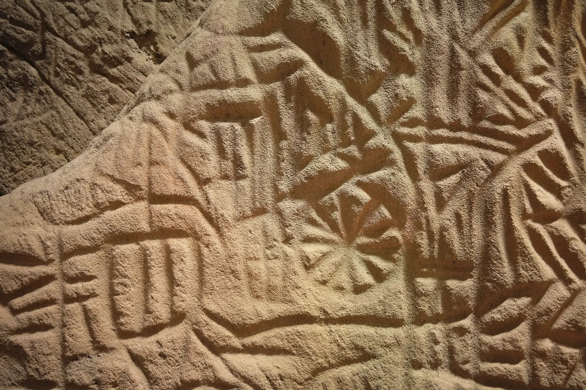 Ancient carvings on the rock walls inside Edakkal Caves